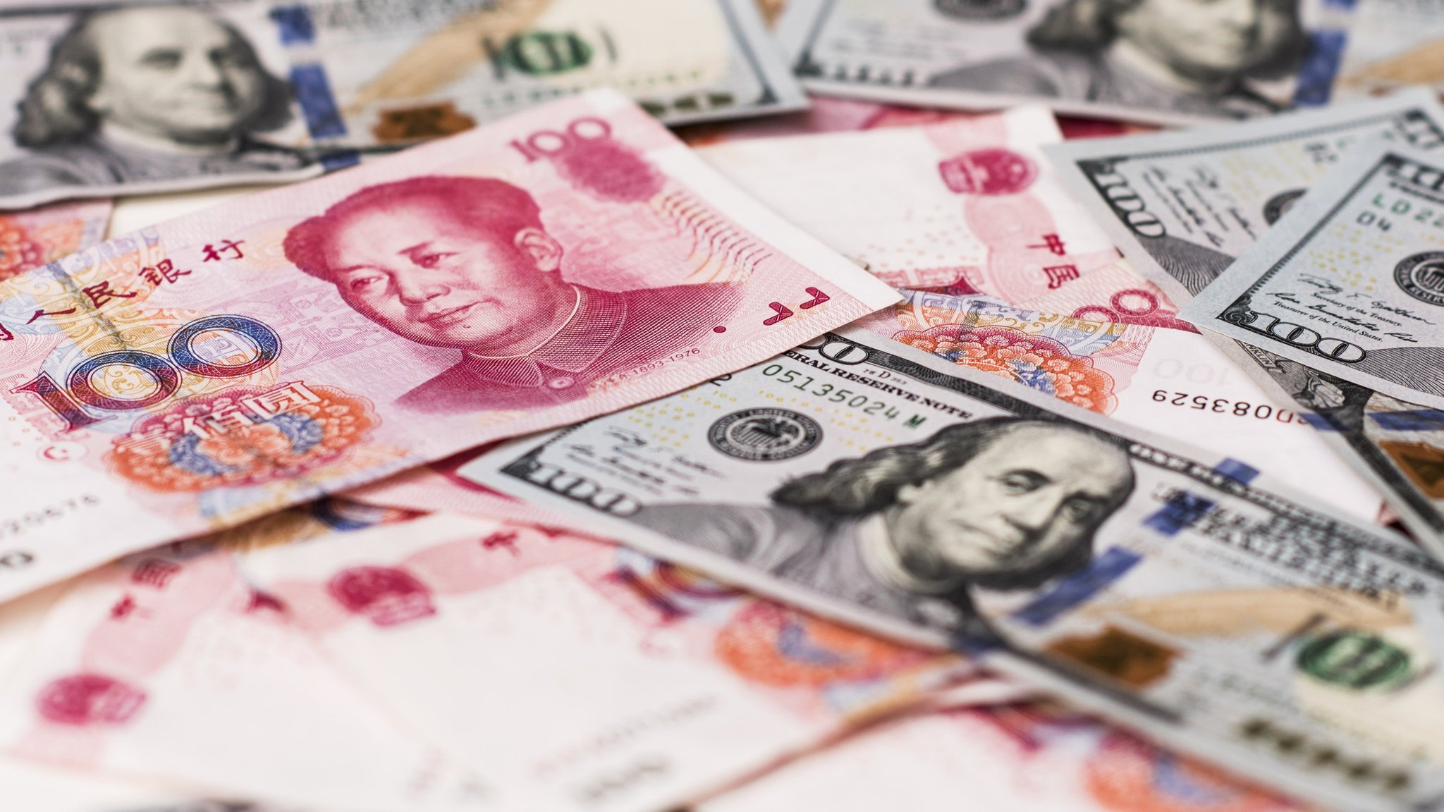 Yuan And Dollar Banknotes Ahead Of Tenth Anniversary Of China's Yuan Reform